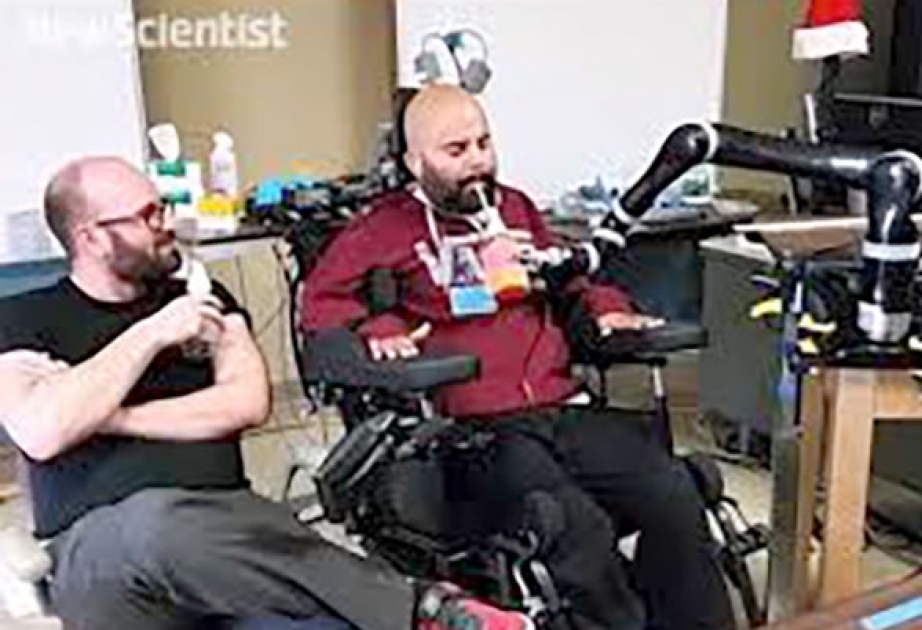 Brain implants let man control robotic arm with thoughts