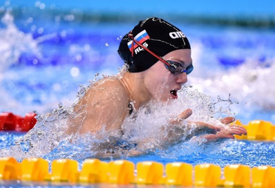 Russians flex their muscles as Swimming starts
