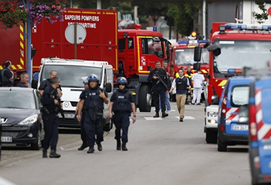 Priest killed in French church, two attackers shot dead