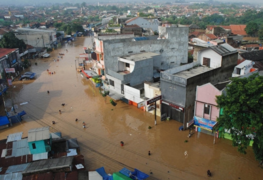 13 dead, thousands caught in flooding in central Indonesia