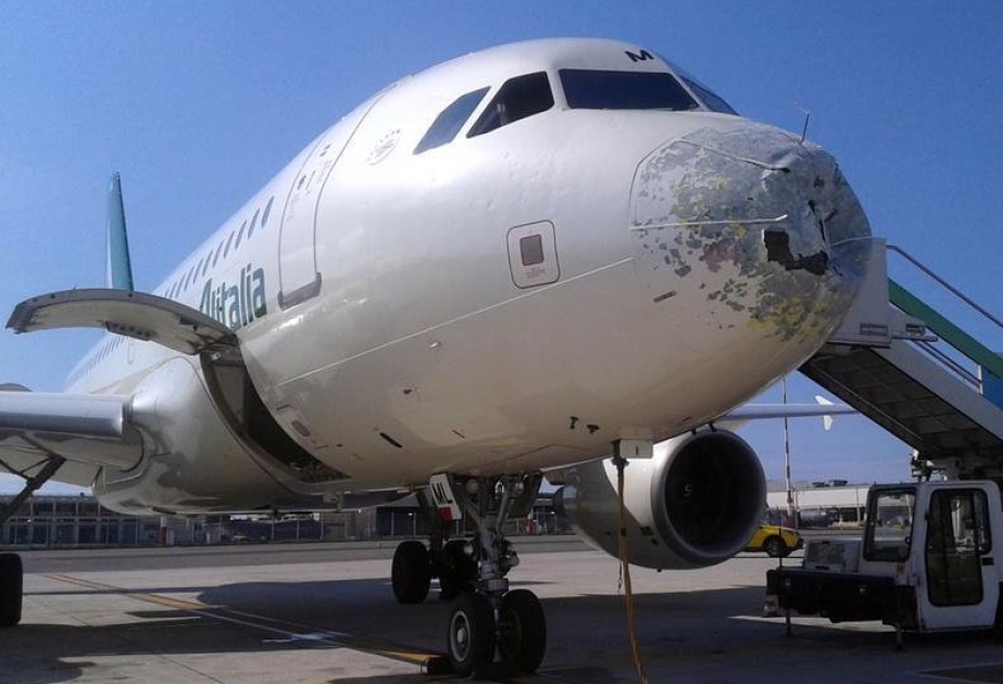 Alitalia flight AZ2016 forced into emergency landing after hailstones smash hole in aircraft
