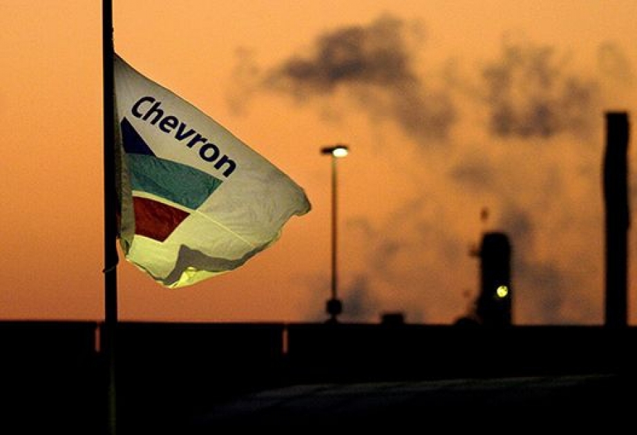 Chevron posts first loss since 2002 in global oil downturn