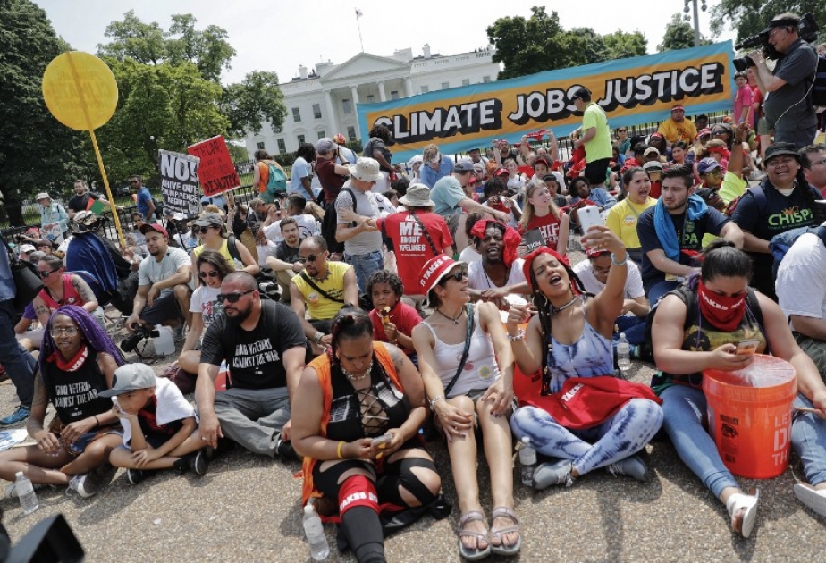 Thousands march against US President`s climate policies
