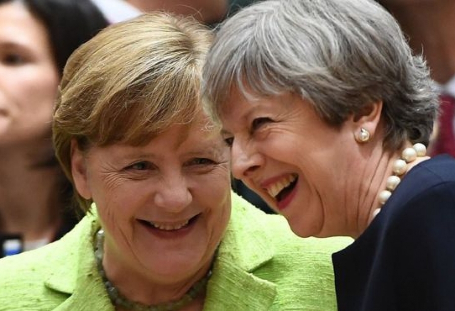 Theresa May offers EU citizens living in Britain full residency