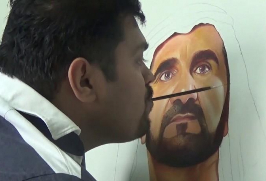 Man paints Sheikh Mohammed's photo with mouth
