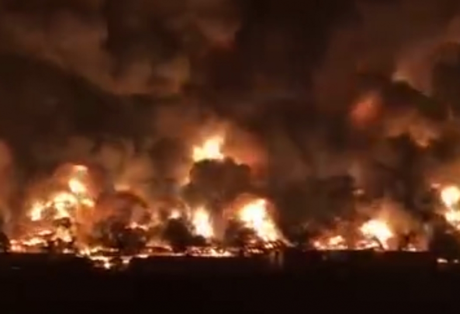 Fire burns east China logistics park