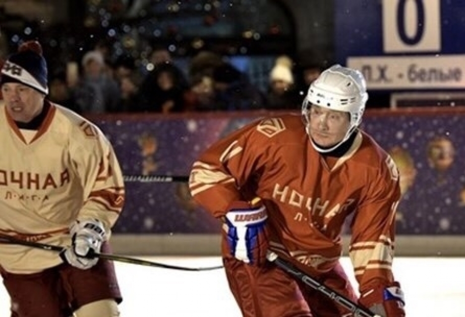 Putin shows off hockey skills on Red Square ice rink