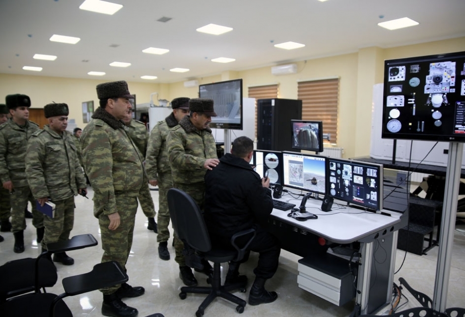 Azerbaijani defense minister checks combat capability of armored vehicles in frontline zone