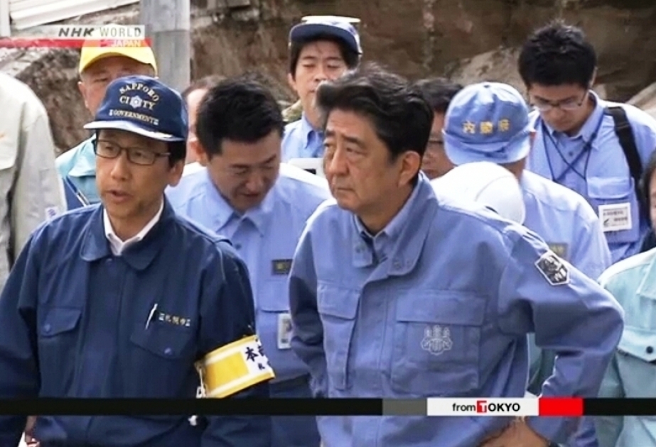 Japan PM Abe visits quake-hit Hokkaido as death toll rises to 37
