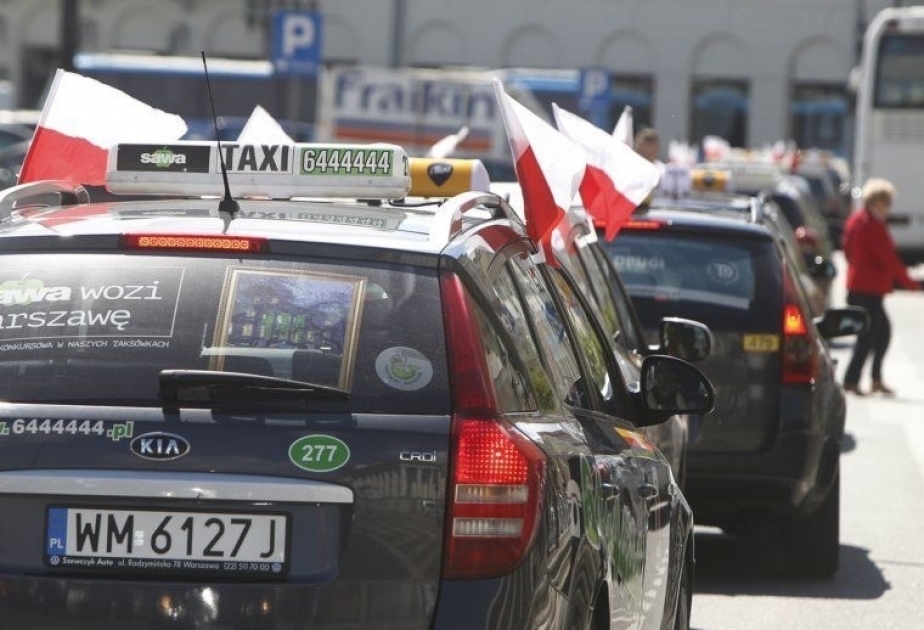 Poland’s taxi drivers hold up traffic over ride-hailing law