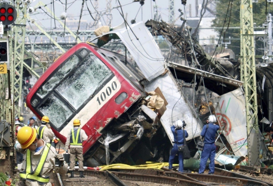 One dead, over 30 injured as train hits truck, derails in Yokohama
