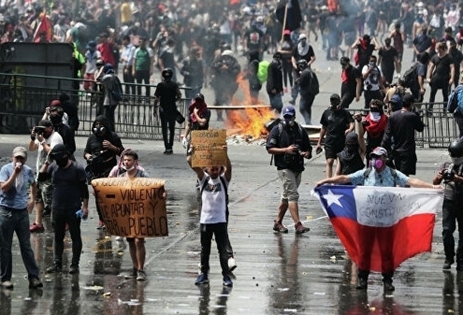 Chilean president cancels Apec and climate summits amid wave of unrest