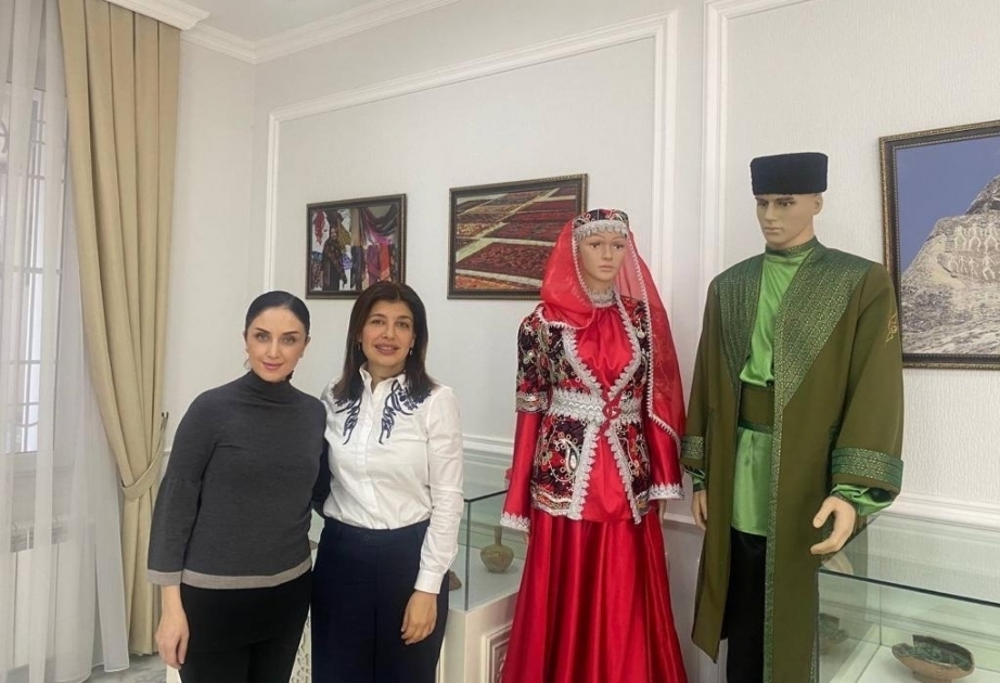 Gulnara Khalilova presents samples of Azerbaijani national clothes to museum of International Turkic Culture and Heritage Foundation