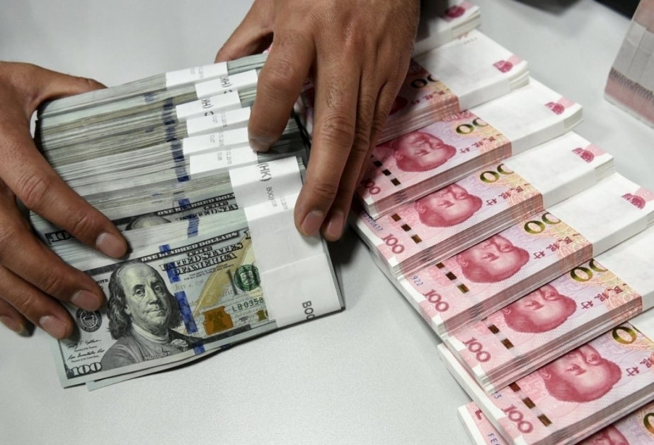 China’s forex reserves edge down in Sept
