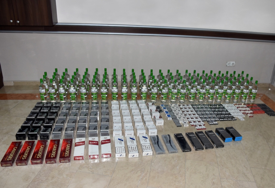 Külli miqdarda siqaret, spirtli içki və bir ədəd odlu silah aşkarlanıb