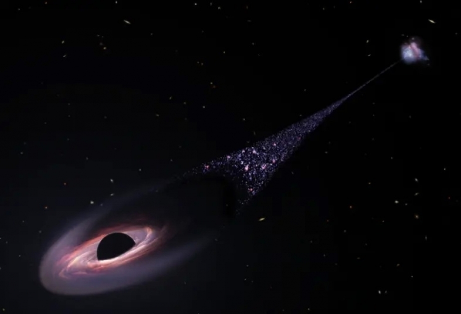 Runaway supermassive black hole is hurtling through space followed by tail of infant stars