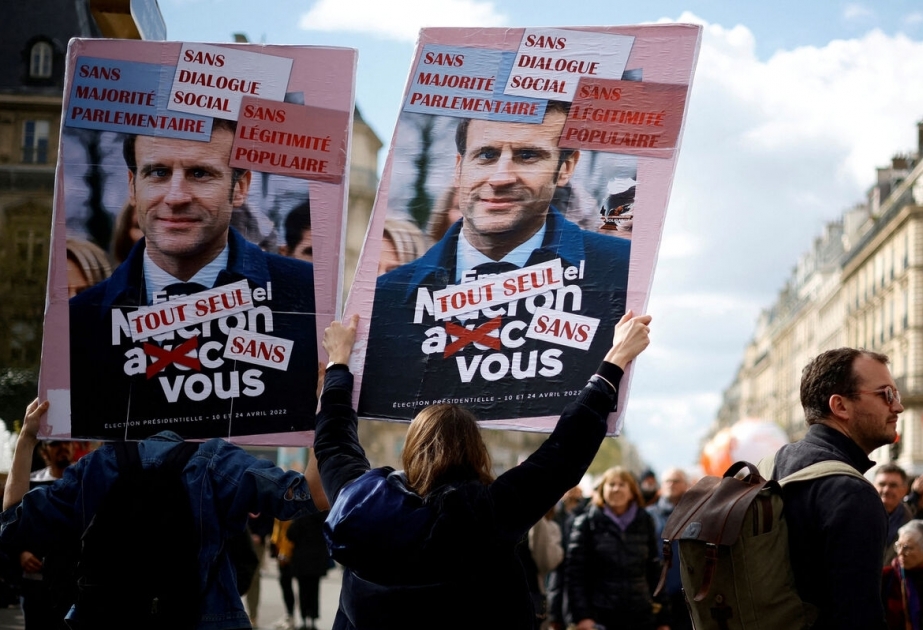 France's President Macron signs controversial pension reforms into law