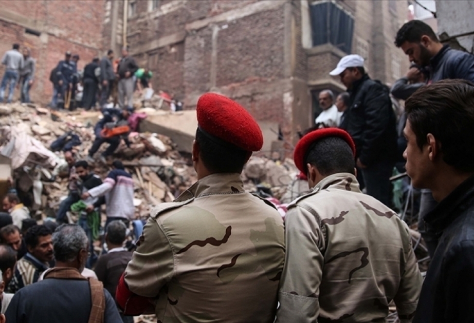 A 5-story apartment building collapses in Cairo and kills at least 12 people, with two missing