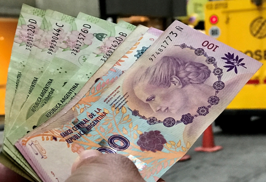 Argentina’s new government halves peso’s value and cuts spending to jolt economy
