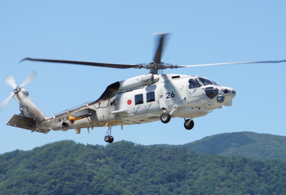 Two Japan navy helicopters crash, one body found, 7 missing