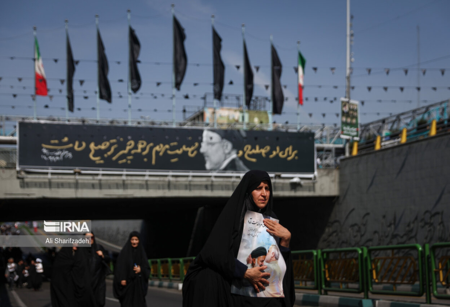 People in Iran bid farewell to late president VIDEO
