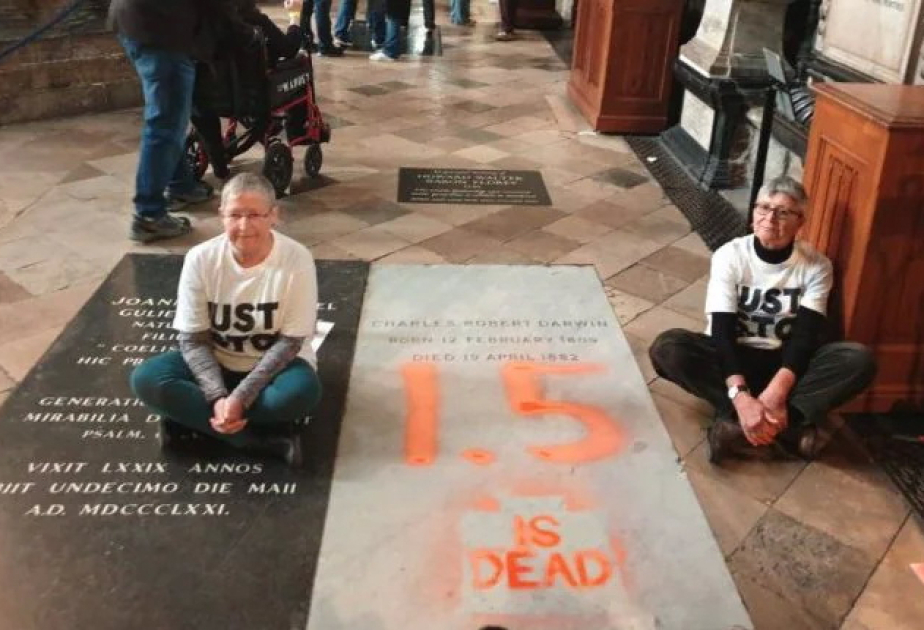 Climate activists deface Darwin's grave at London's Westminster Abbey