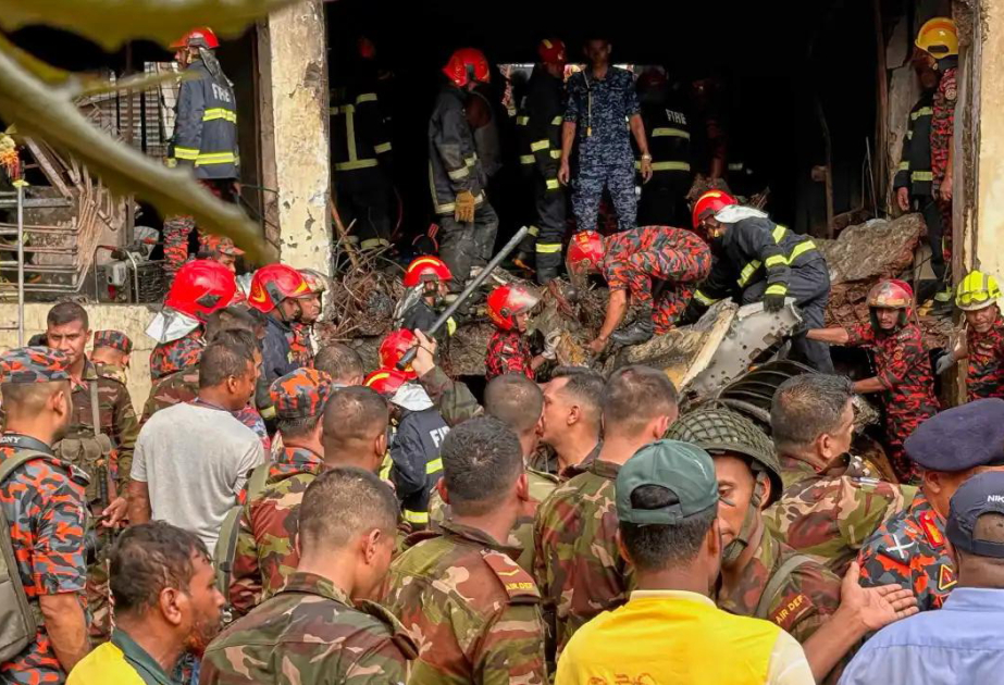 At least 19 killed as Bangladesh air force plane crashes into college campus
