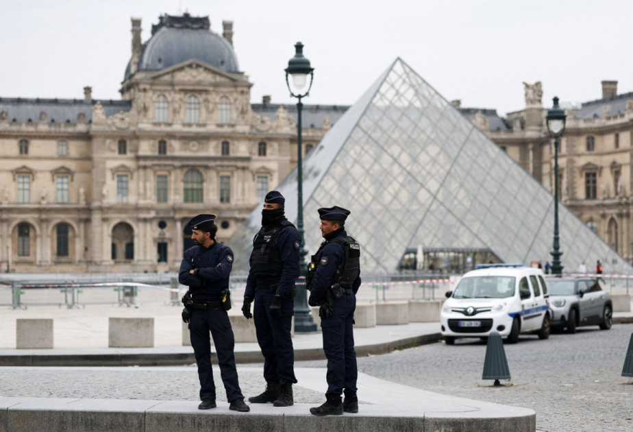 France's Macron orders tighter security as Louvre reopens doors