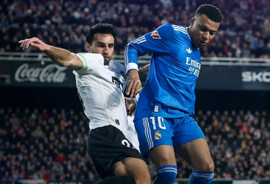Real Madrid edge Valencia to stay on Barca's tail, Atletico slump