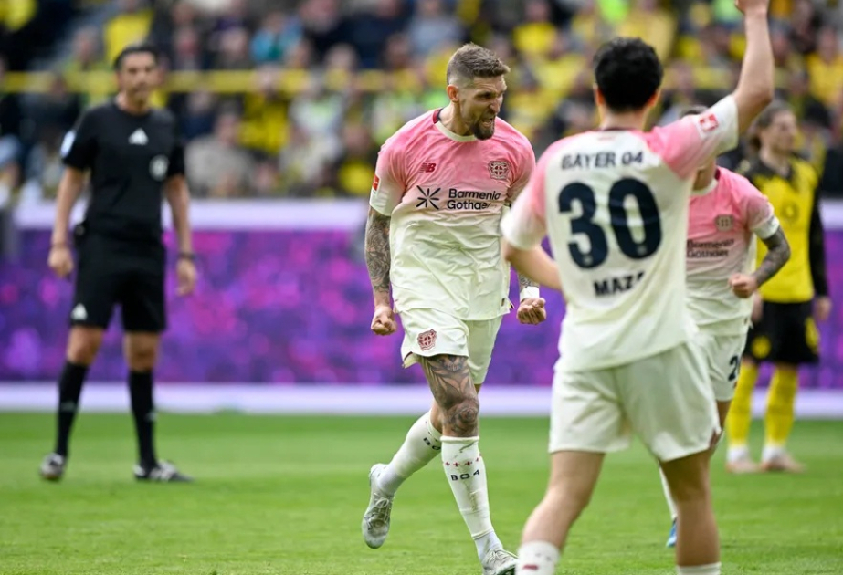 Leverkusen snatch 1-0 win at Dortmund to stay in Champions League contention