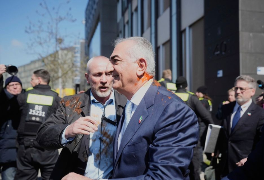 Red liquid thrown at Iranian opposition figure Reza Pahlavi during Germany visit