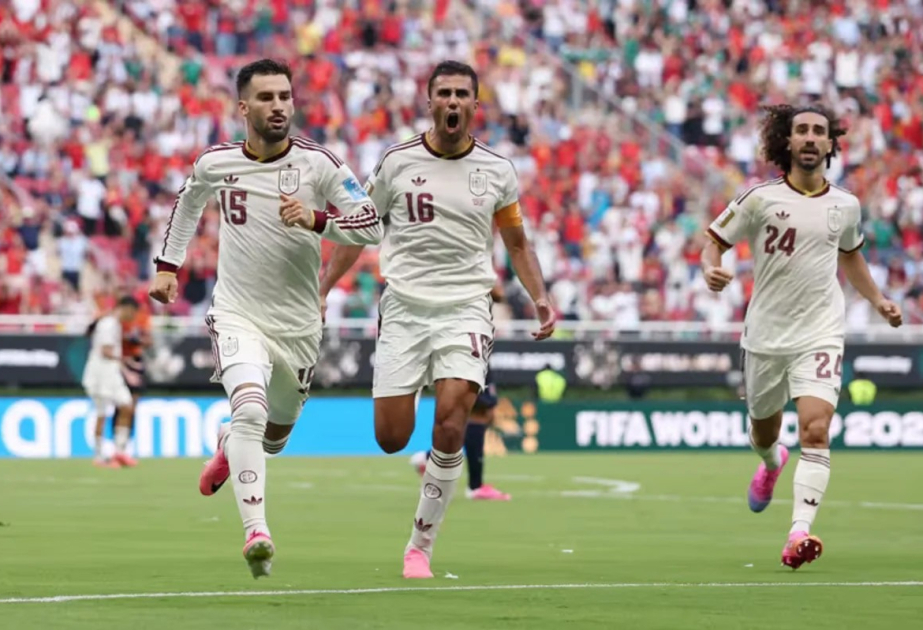Spain edge 10-man Uruguay 1-0 to secure place in next round of World Cup