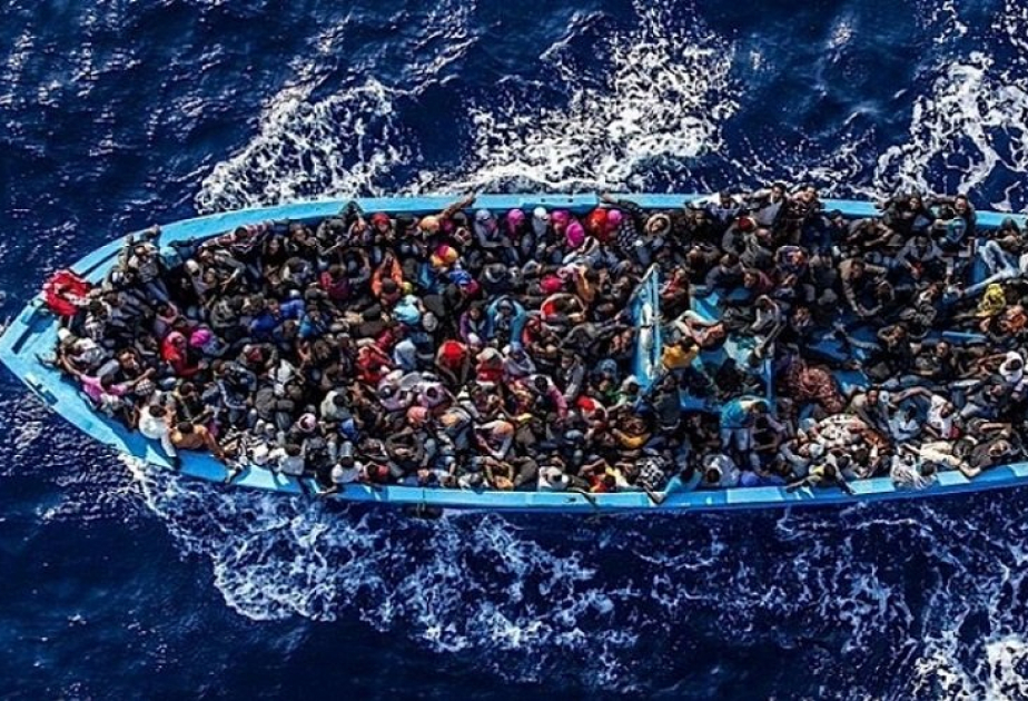 A boat carrying migrants capsizes off Libya’s coast, with at least 50 dead or missing