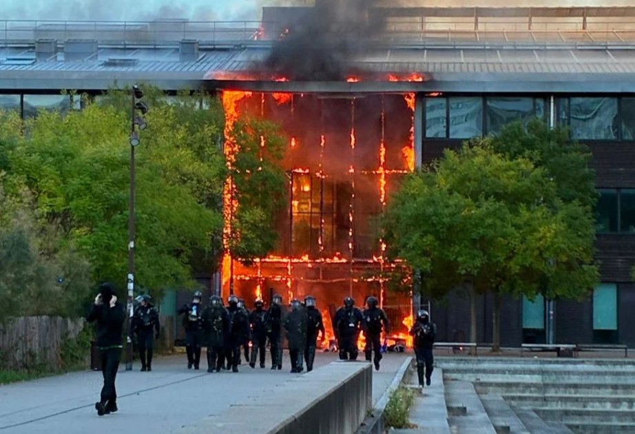 Violent clashes, looting and buildings ablaze in France as over 1,200 arrested after protests