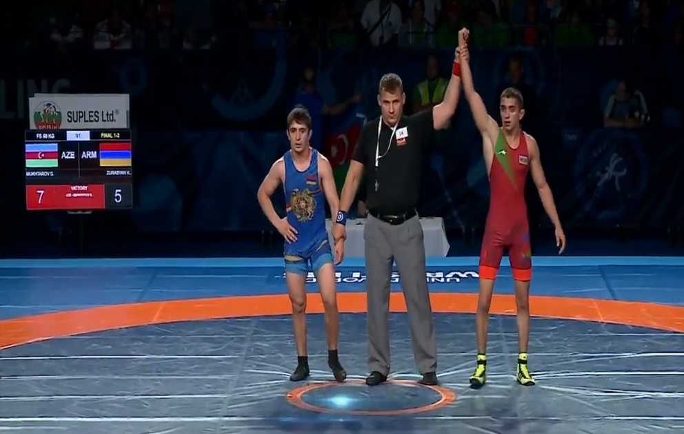 Azerbaijani wrestler beats Armenian rival to claim world gold VIDEO